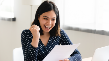 Young woman enjoying to receive a certificate